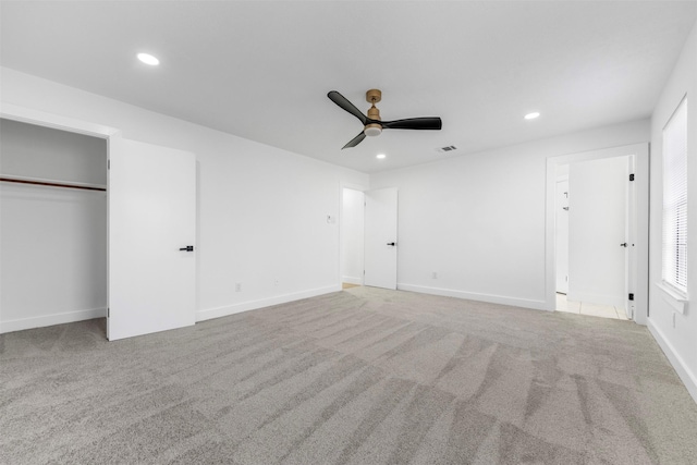 unfurnished bedroom with carpet floors, recessed lighting, visible vents, and baseboards