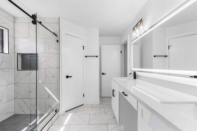 full bath with marble finish floor, a sink, a marble finish shower, and double vanity