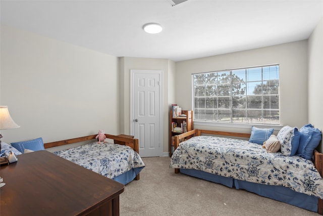 carpeted bedroom with baseboards