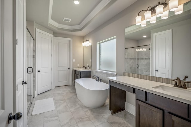 bathroom with a freestanding tub, visible vents, marble finish floor, a stall shower, and a raised ceiling