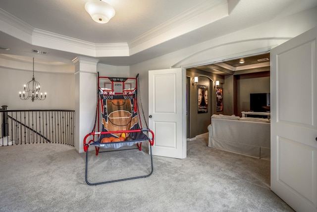 game room with visible vents, a raised ceiling, carpet flooring, and ornamental molding