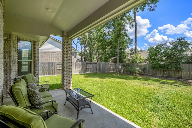 view of yard with a patio area, a fenced backyard, and outdoor lounge area