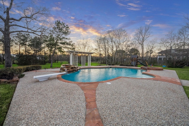 pool at dusk featuring a patio, an exterior structure, an outdoor structure, a diving board, and a fenced in pool