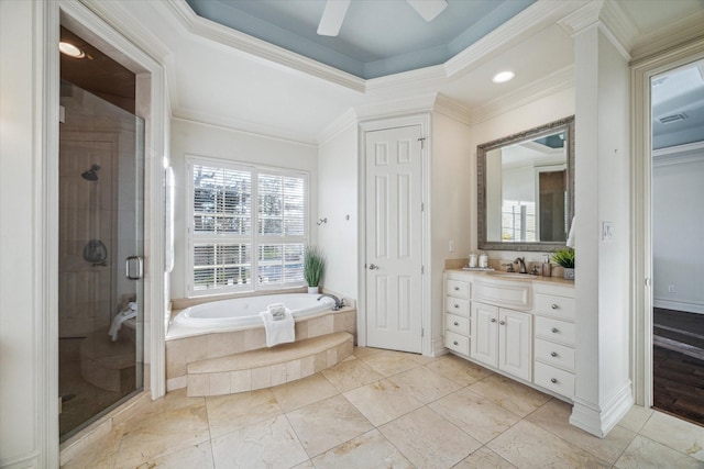 bathroom with a garden tub, crown molding, a tray ceiling, and a shower stall