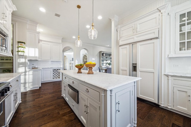 kitchen with a warming drawer, ornamental molding, tasteful backsplash, white cabinetry, and dark wood-style flooring