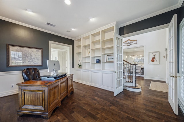 office space with an inviting chandelier, visible vents, wood-type flooring, and ornamental molding