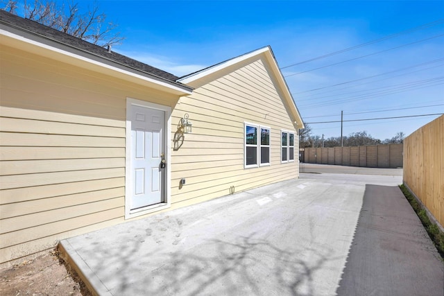 view of patio / terrace featuring fence