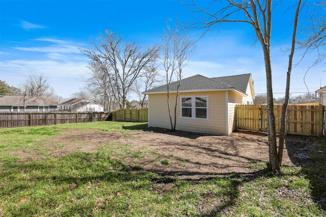 view of yard with a fenced backyard