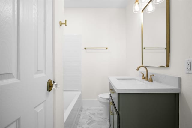 bathroom featuring toilet, marble finish floor, baseboards, and vanity