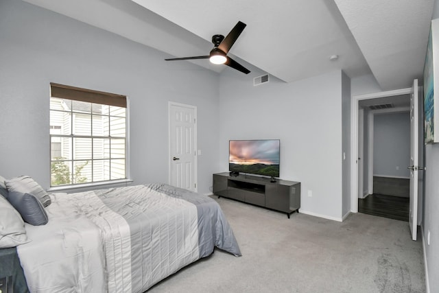 bedroom with light carpet, baseboards, visible vents, and a ceiling fan