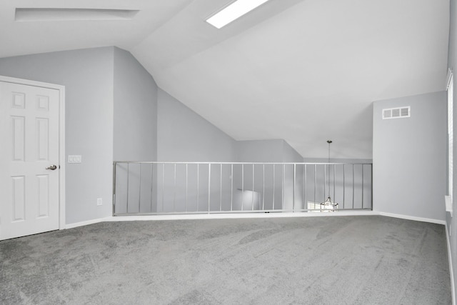 bonus room featuring vaulted ceiling, carpet flooring, visible vents, and baseboards