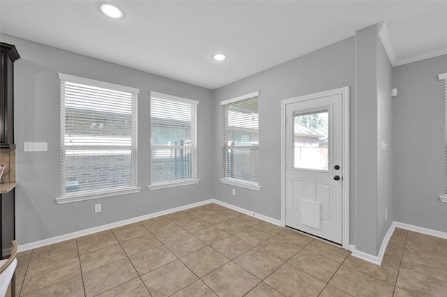 foyer with light tile patterned floors, recessed lighting, and baseboards