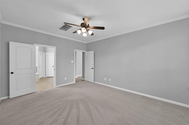 unfurnished bedroom featuring crown molding, light colored carpet, visible vents, a ceiling fan, and baseboards