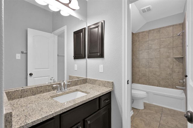 bathroom with visible vents, toilet, tile patterned floors, vanity, and shower / bathing tub combination