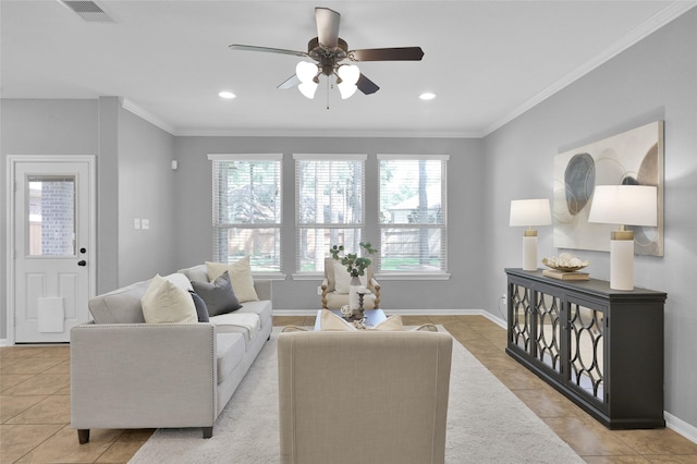 living area featuring light tile patterned floors, baseboards, visible vents, ornamental molding, and recessed lighting