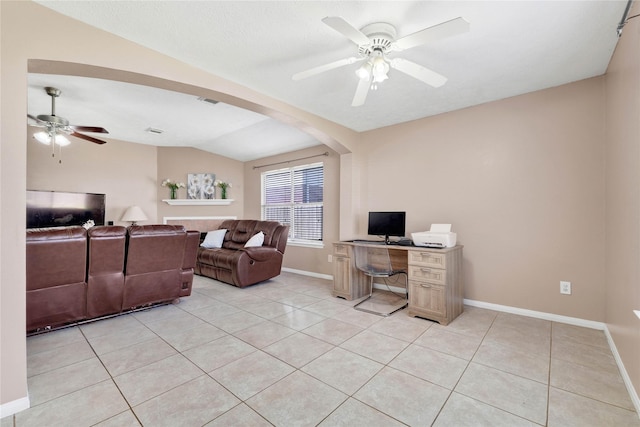 living room with light tile patterned floors, arched walkways, baseboards, lofted ceiling, and ceiling fan