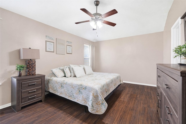 bedroom featuring ceiling fan, dark wood-style flooring, and baseboards