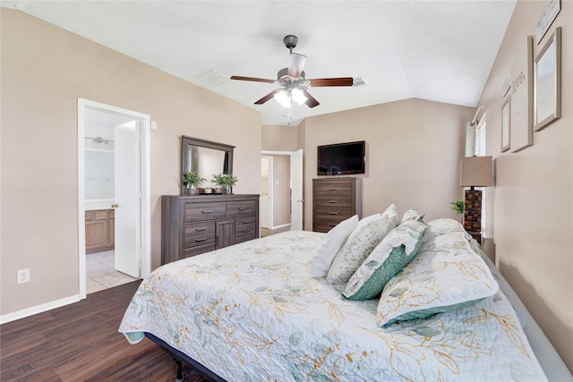 bedroom with ceiling fan, baseboards, vaulted ceiling, and wood finished floors