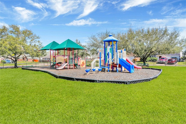 communal playground featuring a yard