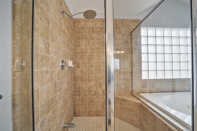 full bathroom with a shower stall and a garden tub