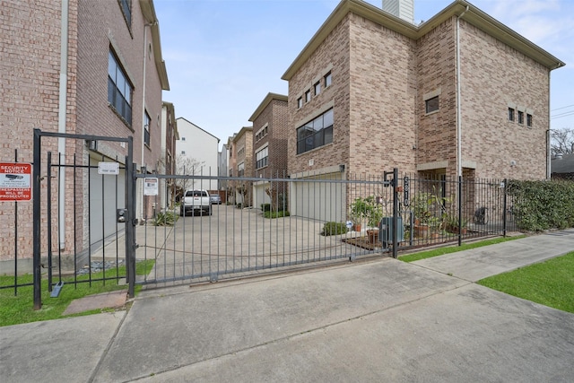 view of gate featuring a fenced front yard