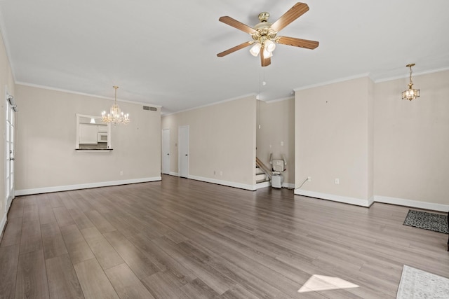 unfurnished living room featuring stairway, wood finished floors, visible vents, and baseboards