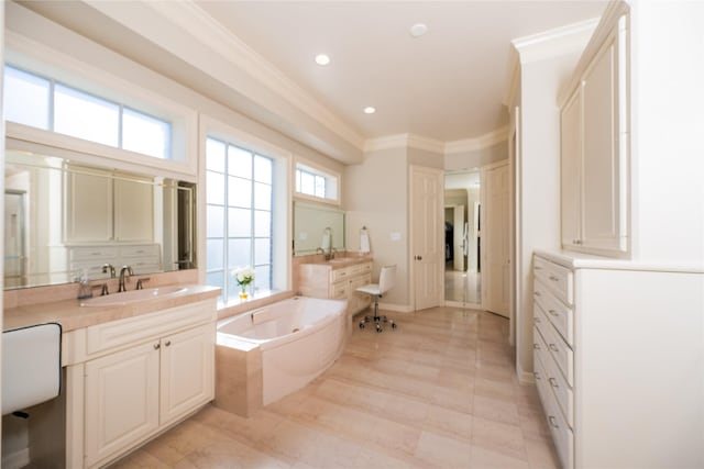 full bath with recessed lighting, vanity, baseboards, a tub with jets, and crown molding