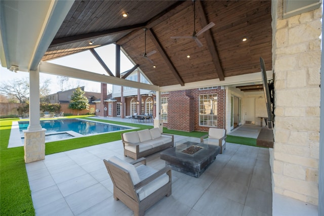 view of patio / terrace with an outdoor living space with a fire pit and a fenced in pool