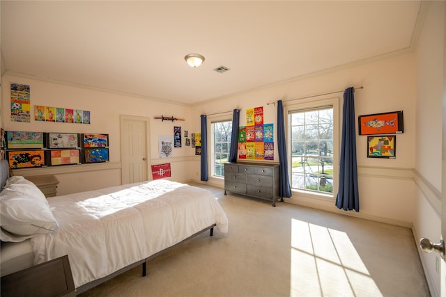 carpeted bedroom featuring baseboards and visible vents