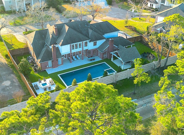 birds eye view of property with a residential view