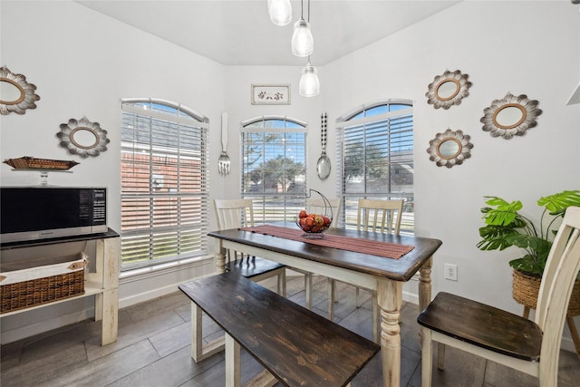 dining space featuring baseboards