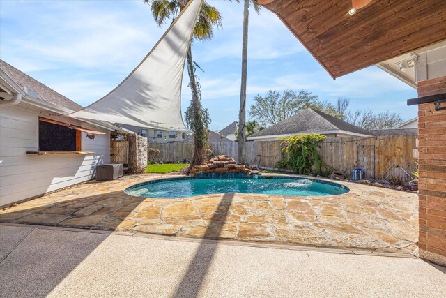 view of pool with a fenced backyard, a fenced in pool, and a patio