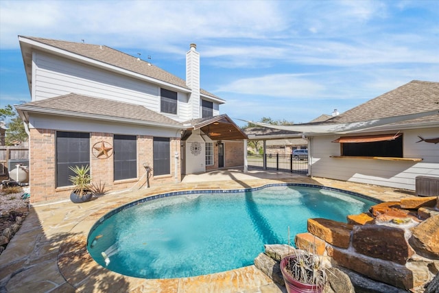 view of swimming pool with a patio area, fence, and a fenced in pool