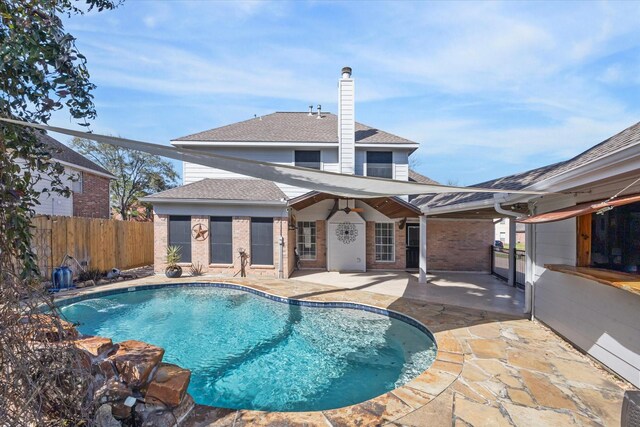 view of pool featuring a patio area, fence, and a fenced in pool