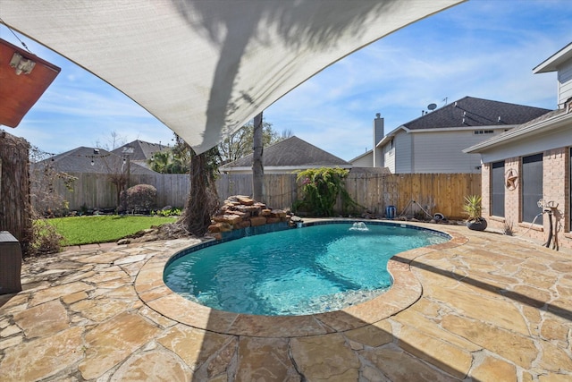 view of pool with a fenced in pool, a patio area, and a fenced backyard