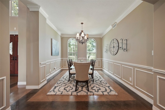 dining room with tile patterned flooring, a decorative wall, and visible vents