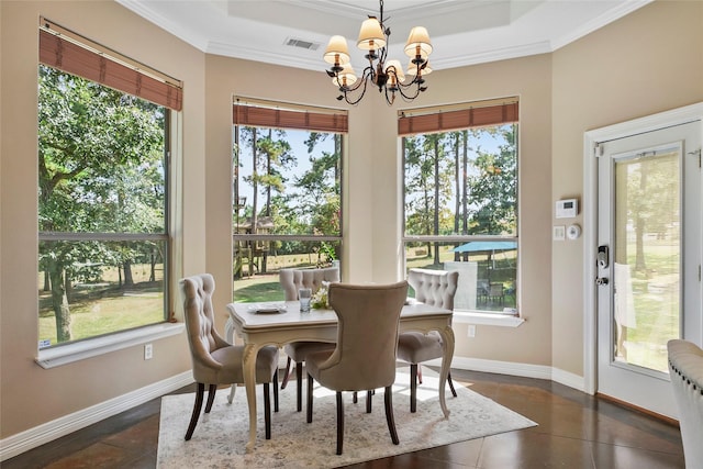 dining room featuring visible vents, baseboards, ornamental molding, a notable chandelier, and a raised ceiling