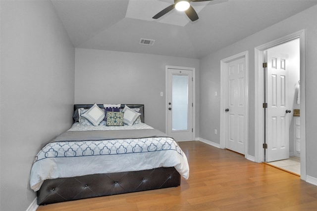 bedroom featuring visible vents, baseboards, wood finished floors, and a ceiling fan