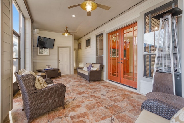 sunroom with a ceiling fan