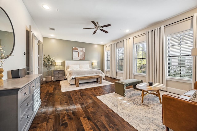 bedroom featuring dark wood-style floors, recessed lighting, visible vents, and baseboards