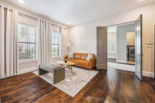 interior space featuring dark wood-style floors, separate washer and dryer, recessed lighting, and baseboards