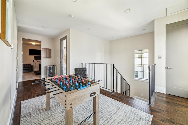 playroom with recessed lighting, wood-type flooring, and baseboards