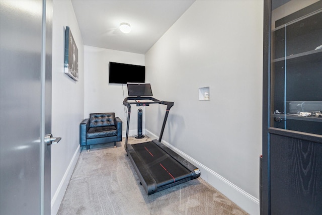 exercise area with carpet flooring and baseboards