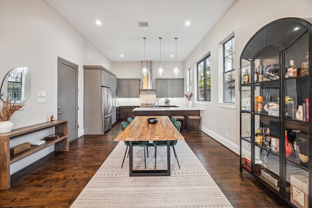 interior space with recessed lighting, visible vents, dark wood finished floors, and baseboards