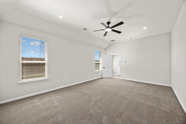 carpeted spare room featuring recessed lighting, a ceiling fan, visible vents, vaulted ceiling, and baseboards