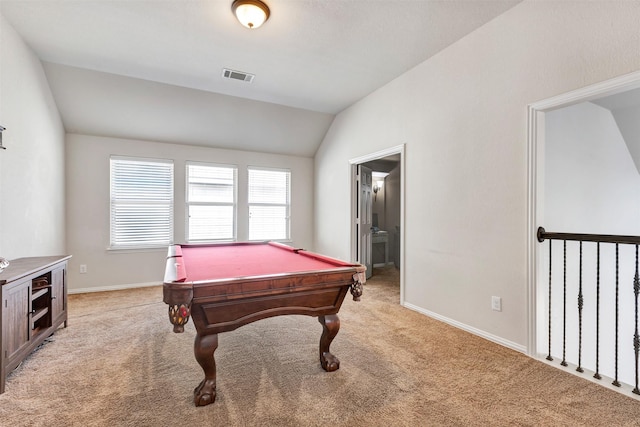 game room featuring baseboards, visible vents, lofted ceiling, and light carpet