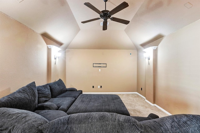 carpeted home theater room featuring ceiling fan, baseboards, and vaulted ceiling