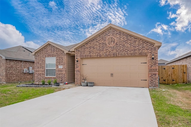 ranch-style home with driveway, an attached garage, fence, a front lawn, and brick siding