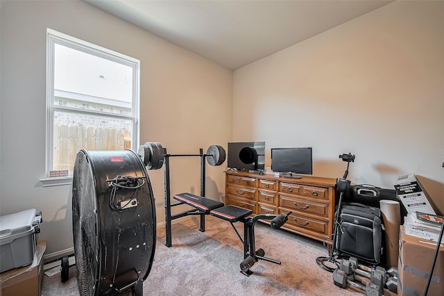 carpeted office space featuring baseboards