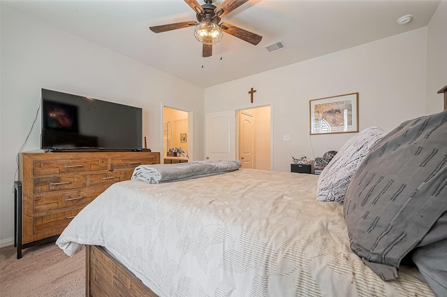 carpeted bedroom featuring visible vents and a ceiling fan